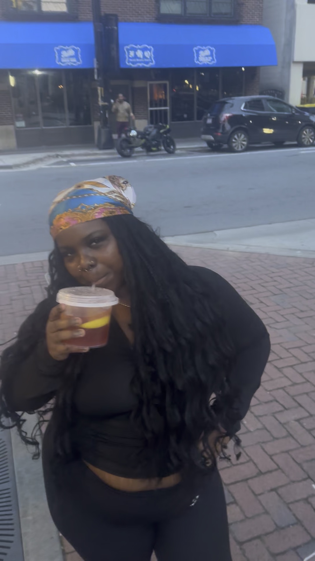 Customer enjoying fruit punch downtown