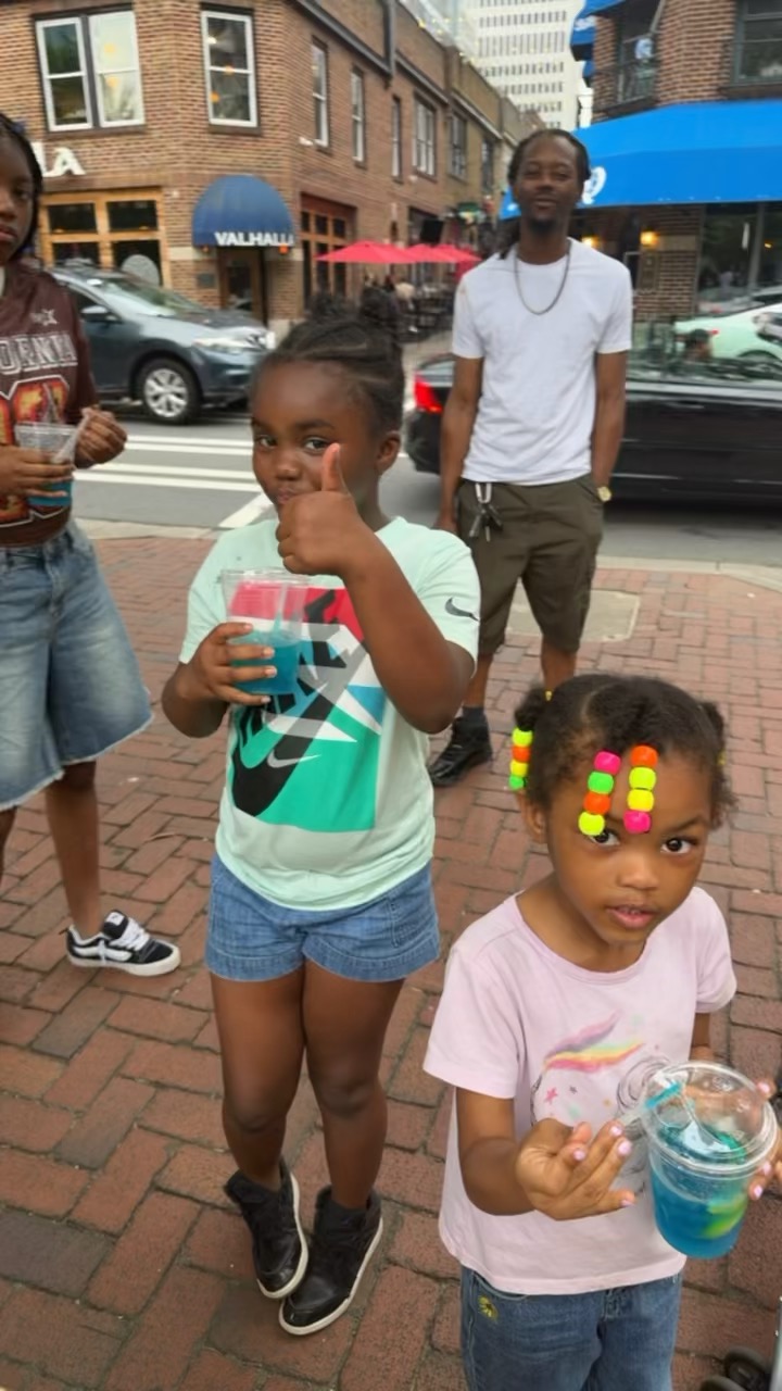 Happy kids with blue lemonade drinks