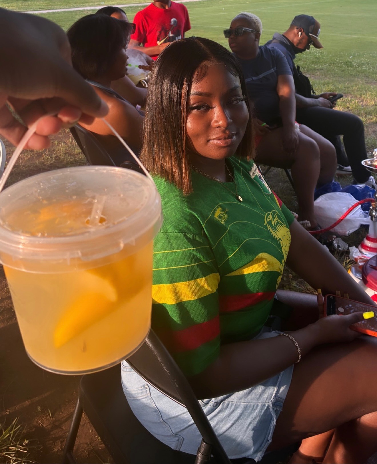 Customer with fresh lemonade at soccer event